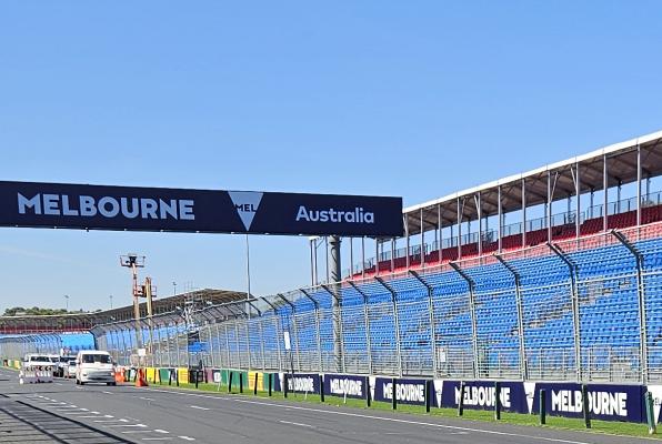 An empty stretch of the Albert Park Circuit with Melbourne signage)