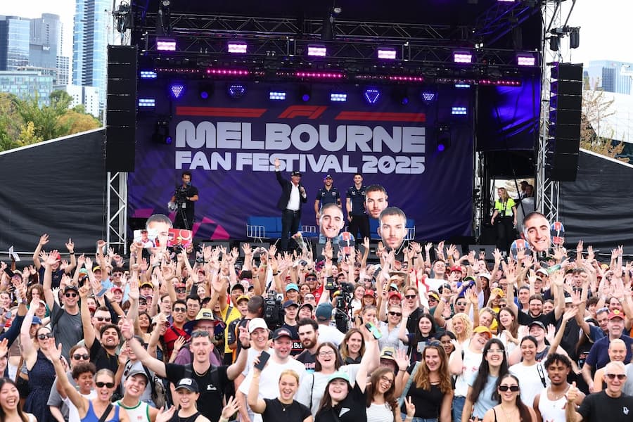 Crowd of people in front of a stage enjoying the Melbourne Fan Festival 2025