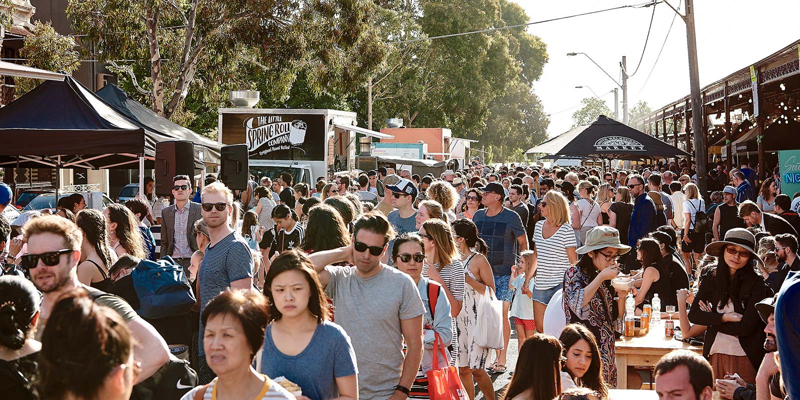 A crowd of people gather at an outdoor food festival in Melbourne